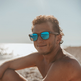 Walnut wood classic style sunglasses with semi-transparent grey frame and blue mirrored polarized lenses