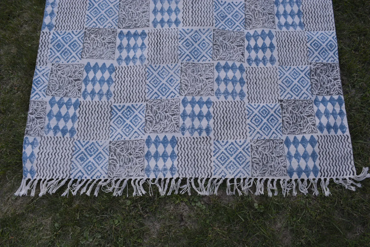 INDIGO DYED HANDWOVEN BLOCK PRINTED COTTON RUG WITH FLORAL DESIGN